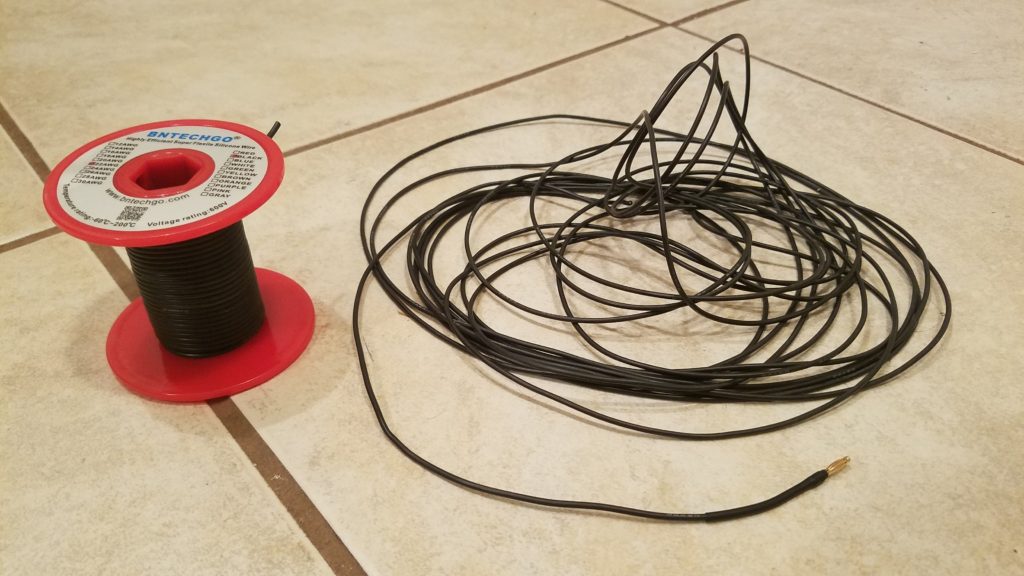 The 22 awg wire cut to length for the 40 meters band (25 ft counterpoise), with the banana plug connector for the KX2 already installed