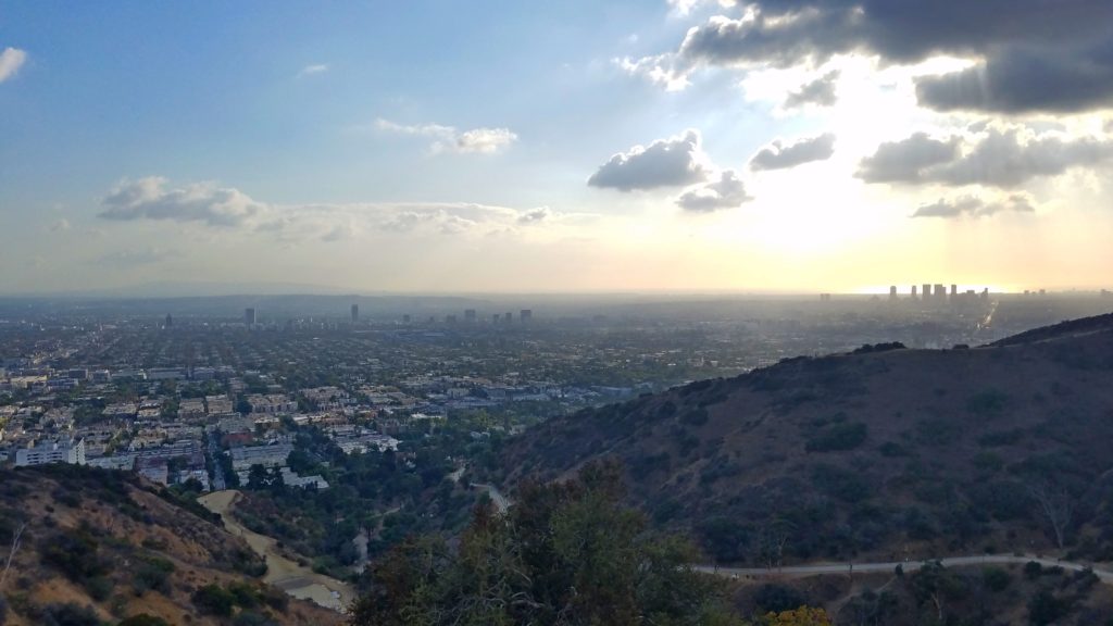 Los Angeles from the hill, and the Sun reflecting in the Pacific Ocean.